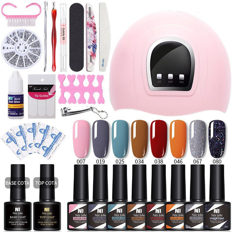 UV/LED gel nail kit with pink lamp, nail swatches, base and top coat bottles