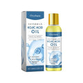 Gold-capped face and body oil essence bottle with blue box.