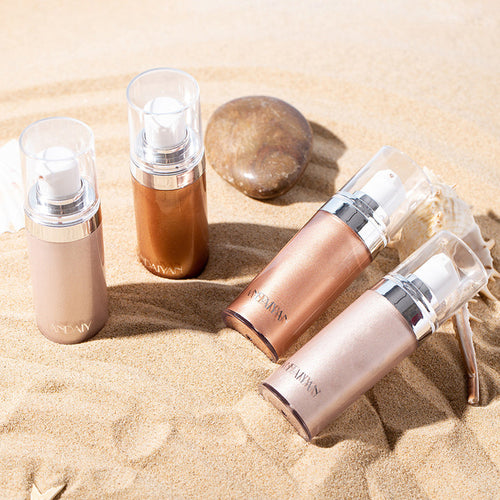 Shimmer body highlighter bottles with luminescent finishes in light, rose, bronze, and gold tones