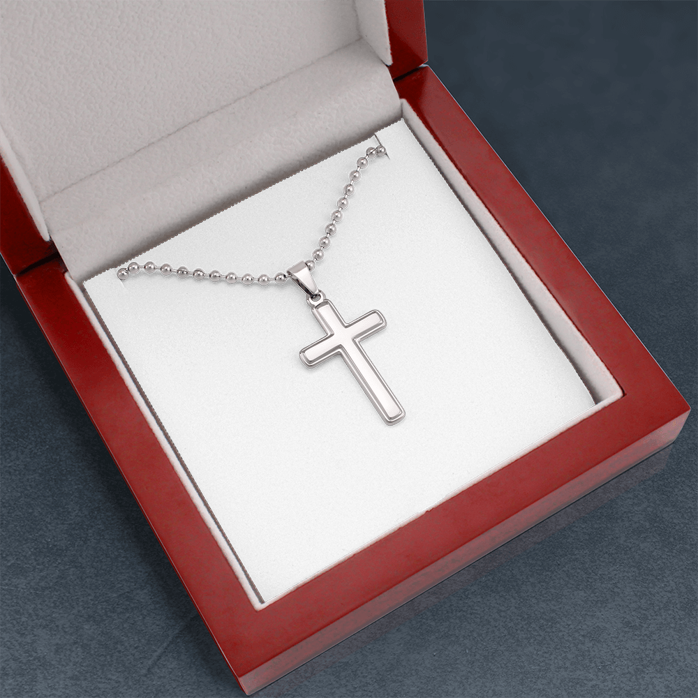 Silver cross pendant necklace with ball chain in an open red gift box
