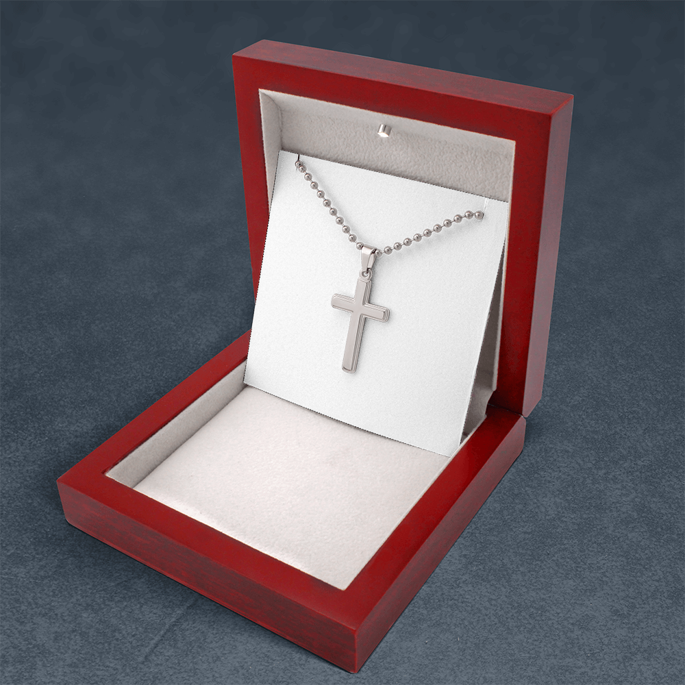 Silver cross pendant necklace with ball chain displayed in an open red box