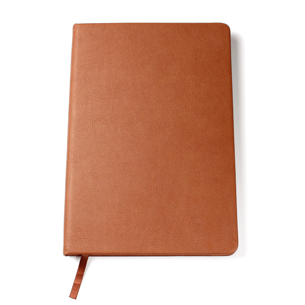 Orange vegan leather journal cover with textured finish and brown stitched edge