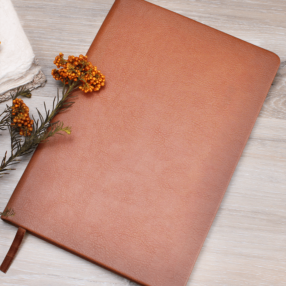 Orange journal with ribbon bookmark and textured faux-leather cover