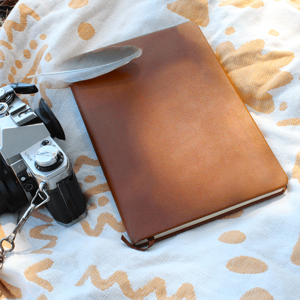 Orange journal with rounded corners, elastic band, and ribbon bookmark