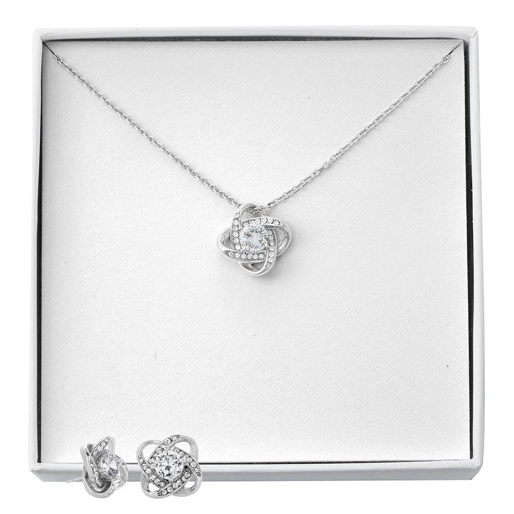 Silver-tone heart love-knot necklace and matching stud earrings in gift box