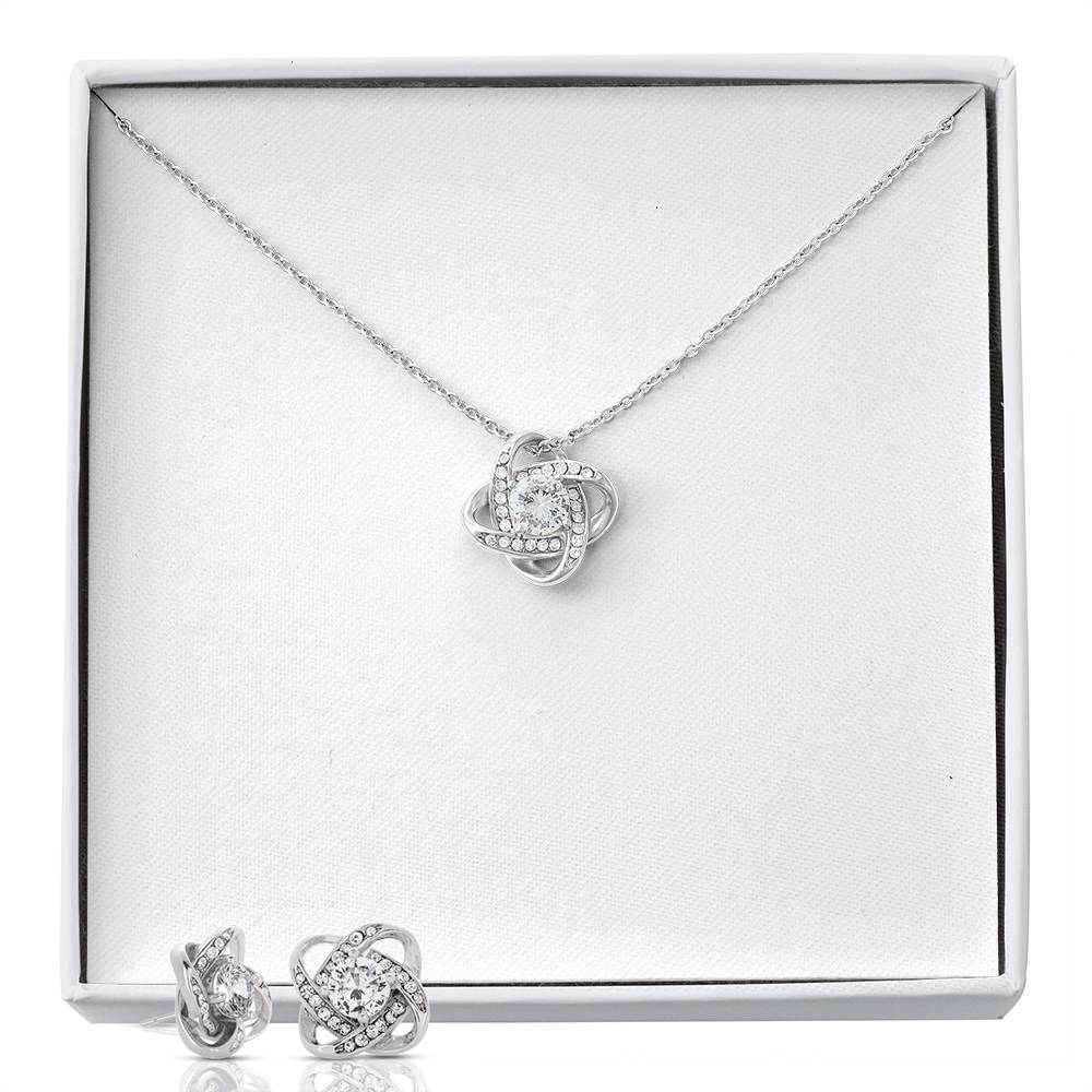 Silver-tone heart love-knot pendant necklace with matching stud earrings, boxed