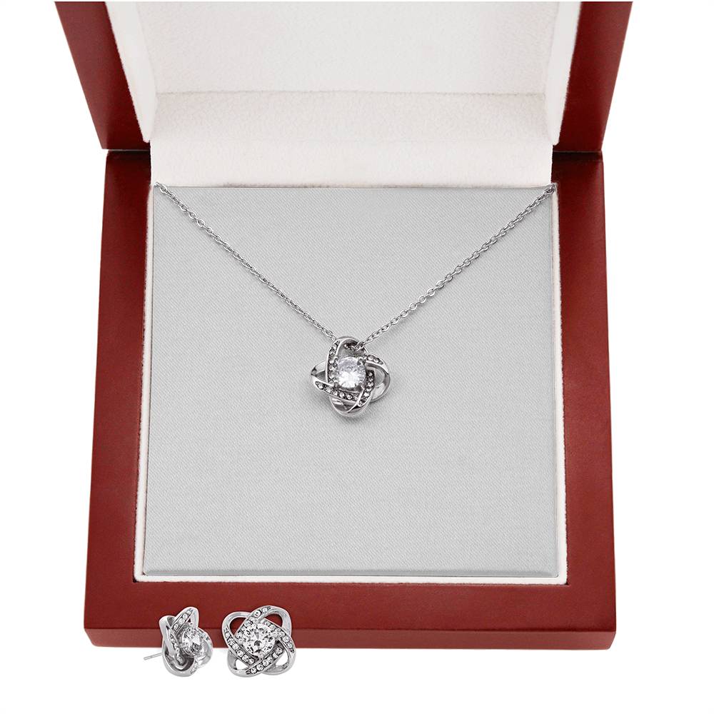 Silver-tone heart love-knot necklace with stud earrings in open gift box