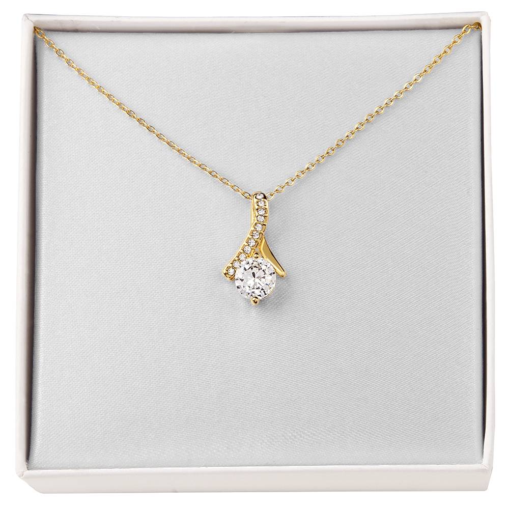 Yellow gold necklace with teardrop pendant set with clear stones, fine chain
