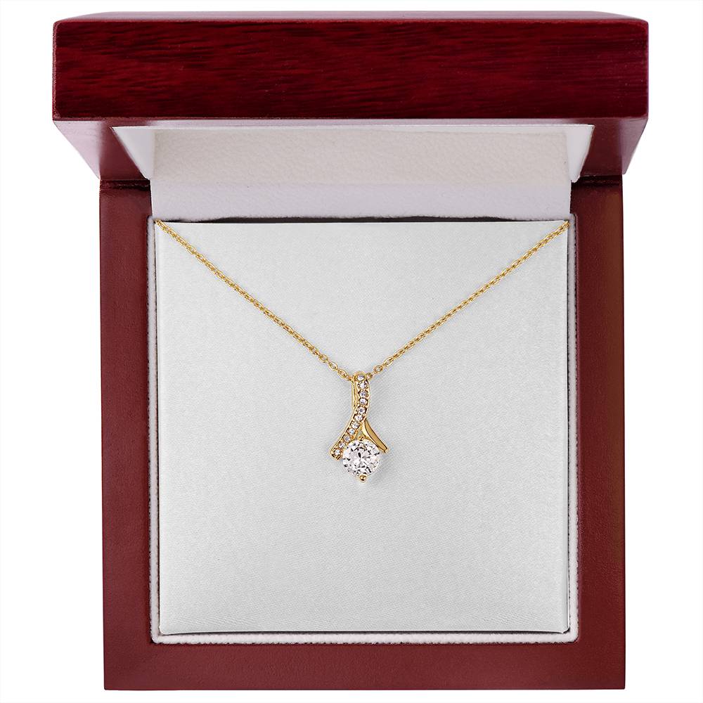 Yellow gold necklace with teardrop pendant and round clear gemstone, cable chain