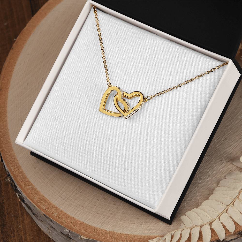 Interlocking hearts pendant necklace with yellow gold heart design and chain