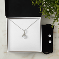 Necklace and earring set with teardrop pendant and two round stud earrings