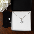 Necklace and earring set: round halo pendant necklace and two stud earrings.