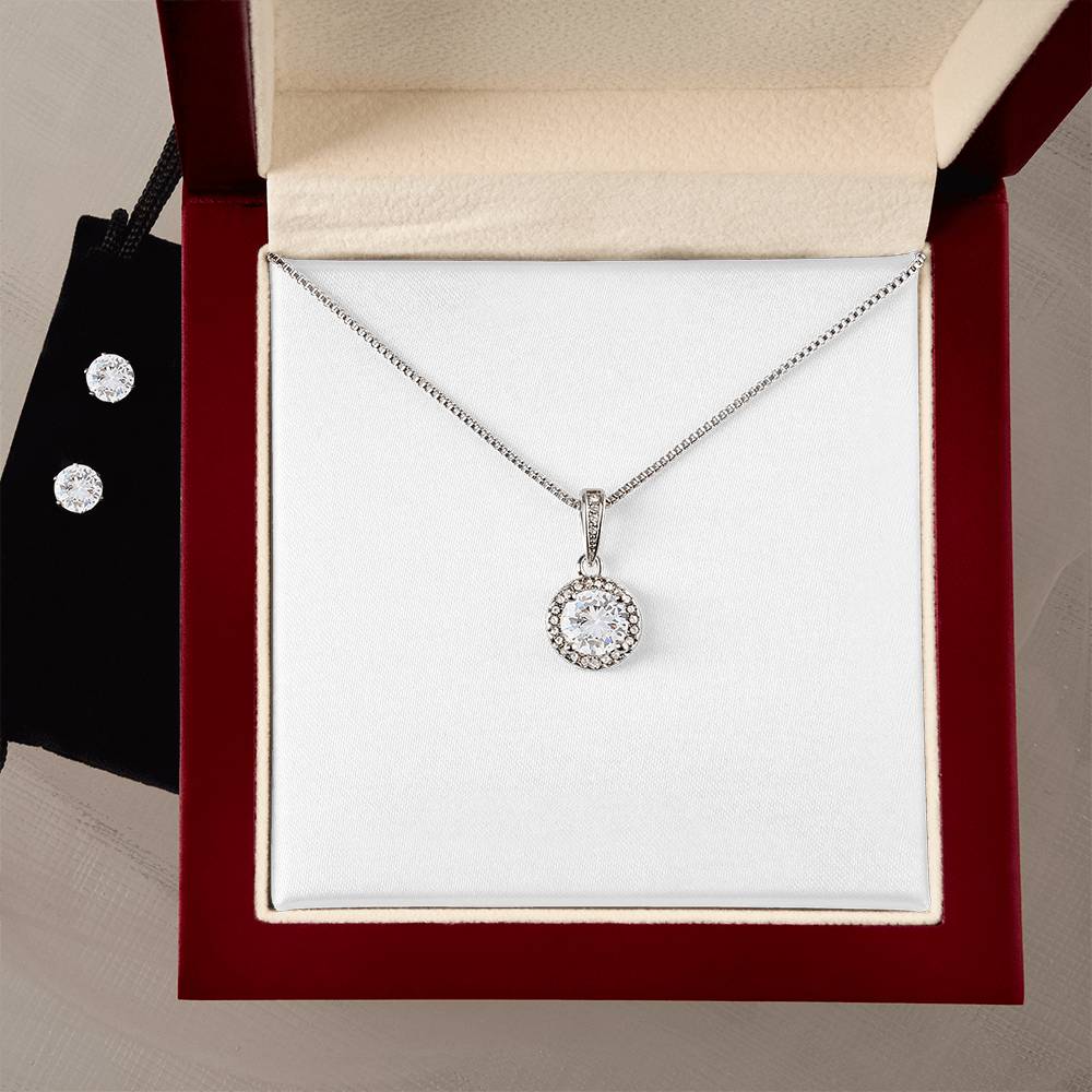 Halo pendant necklace with round crystal charm on chain, in a gift box.