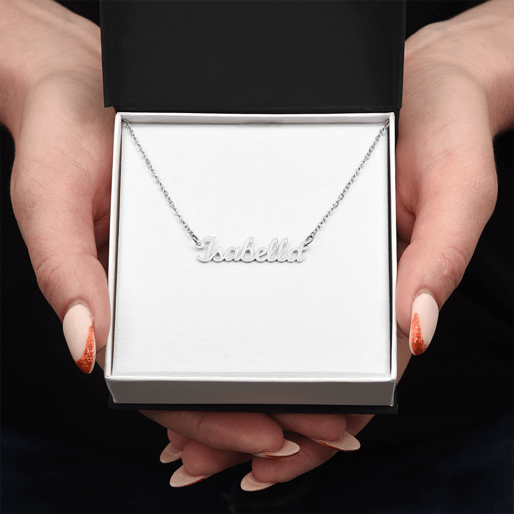 Silver-tone name pendant necklace with “Isabella” script on a chain, held up