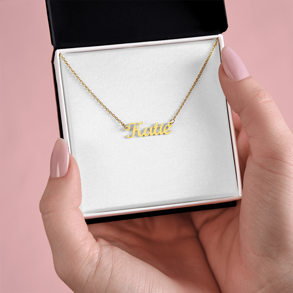 Gold-tone name pendant necklace with “Katie” script on a chain