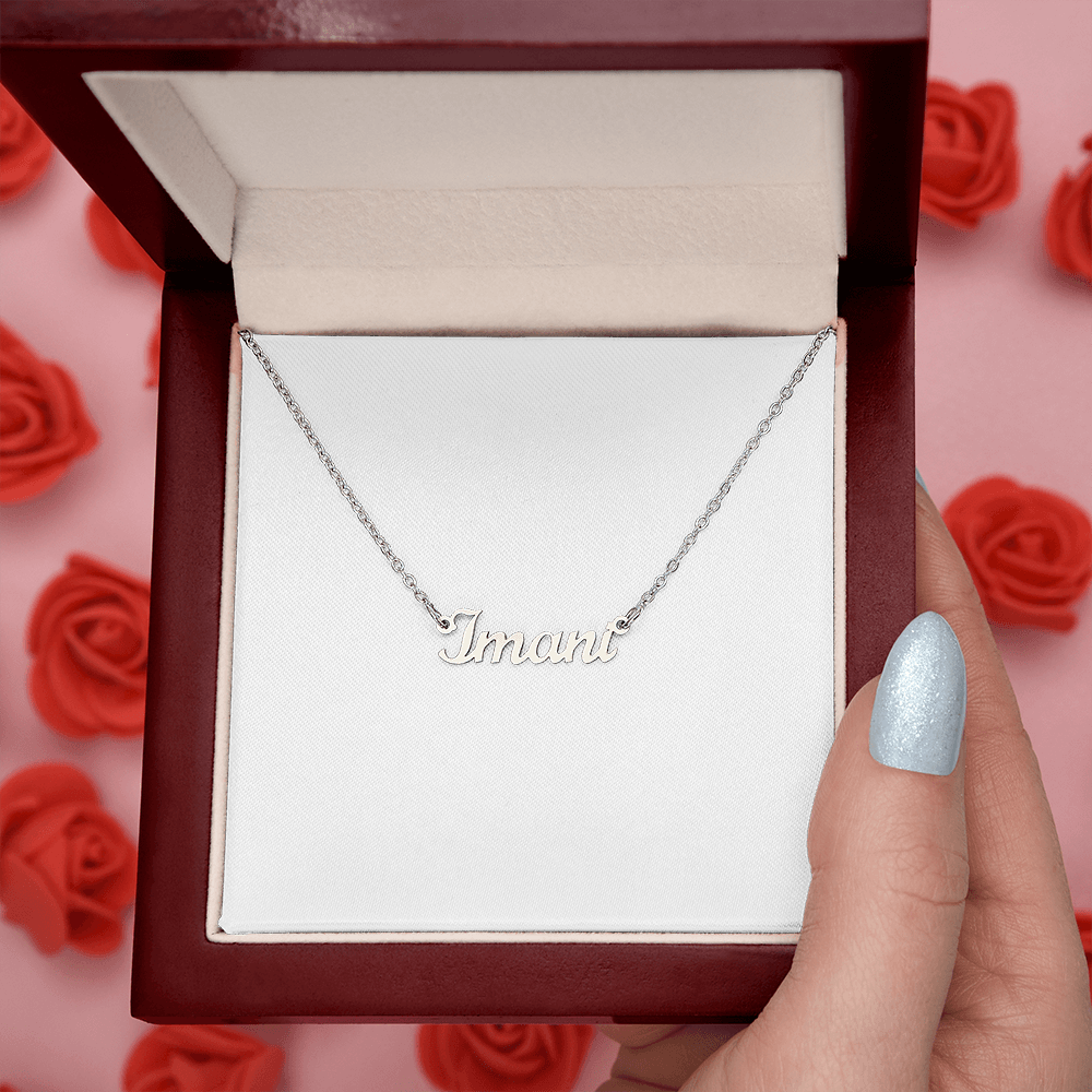 Silver-tone name pendant necklace with “Imani” script on a chain
