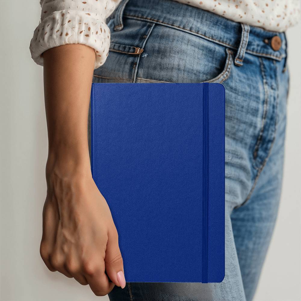 Royal blue Ambassador Bound journal held in hand, with stitched spine detail