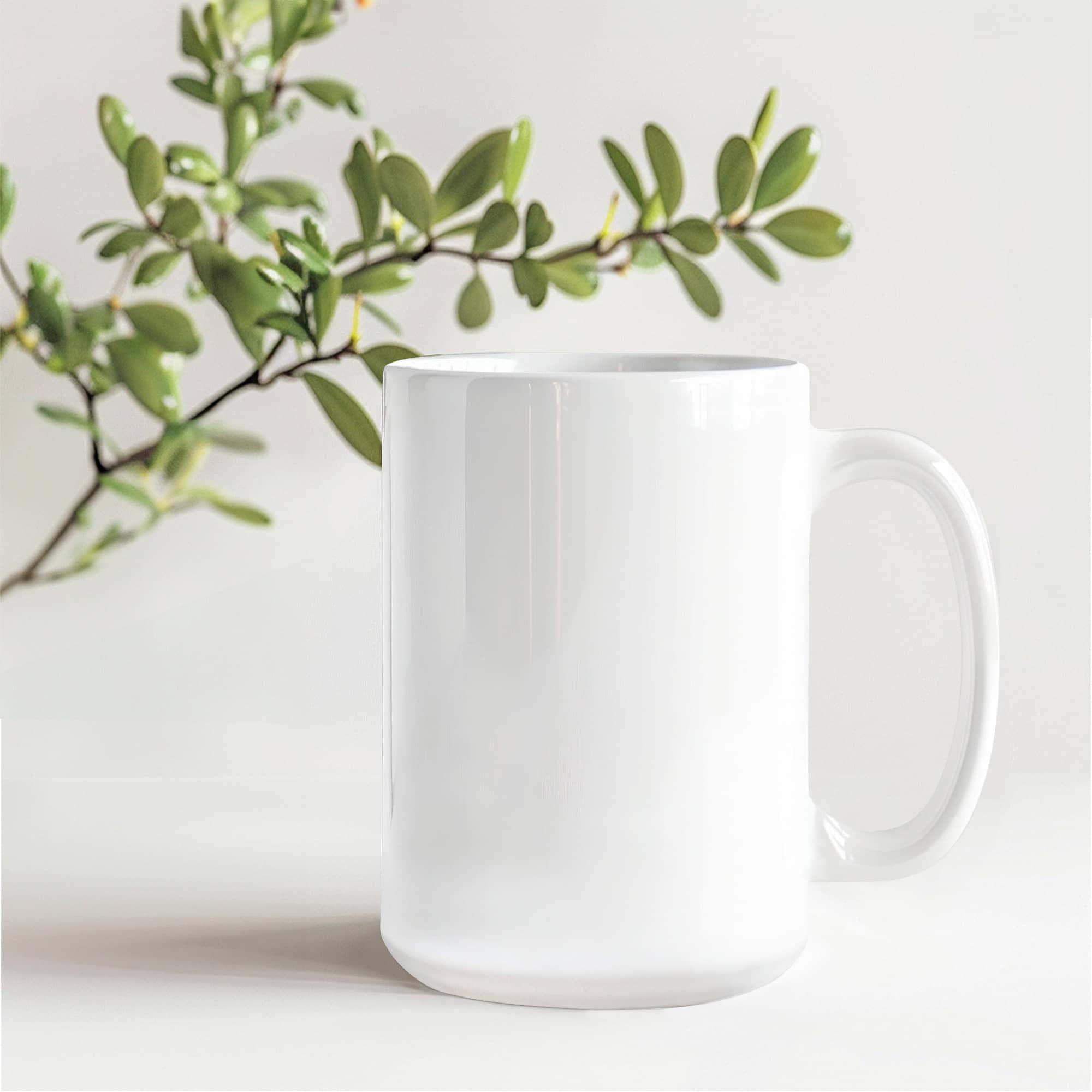 White ceramic mug with curved handle and glossy finish