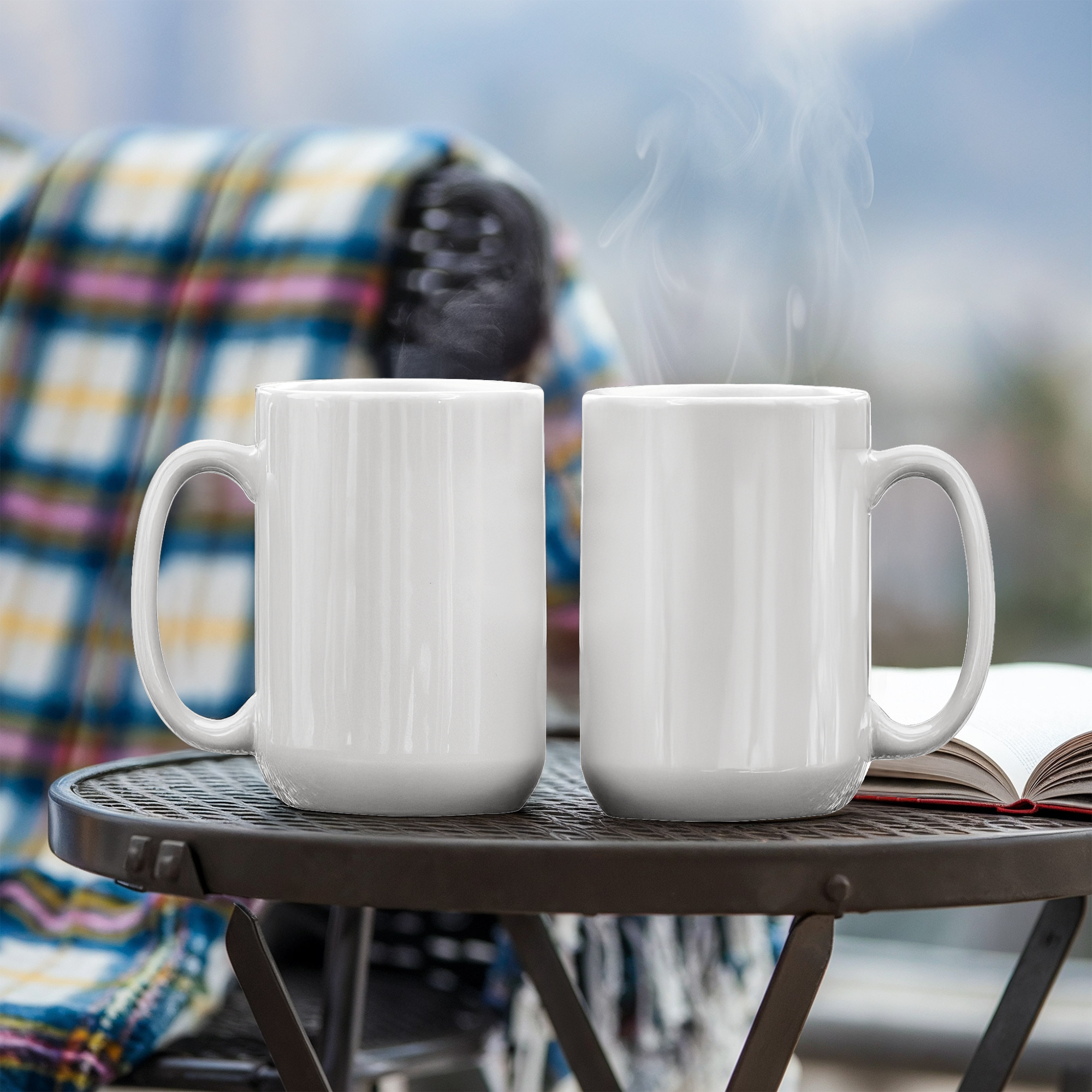 Two white ceramic mugs with curved handles, shown side by side