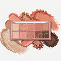 Eyeshadow palette with 9 warm nude shades in a clear compact with mirror