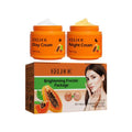 Orange cream jars with day and night labels, plus Brightening Freckle package box.